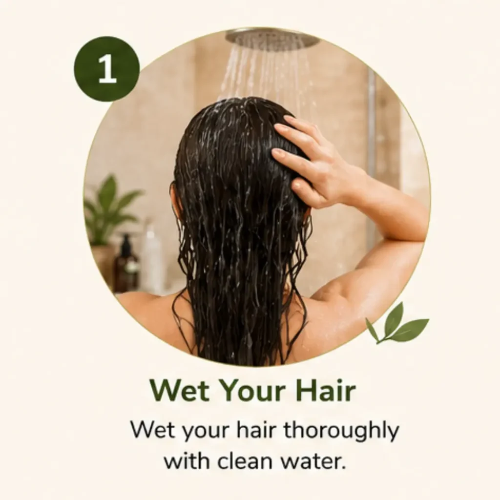Person wetting hair thoroughly under a shower using lukewarm water before applying herbal shampoo.